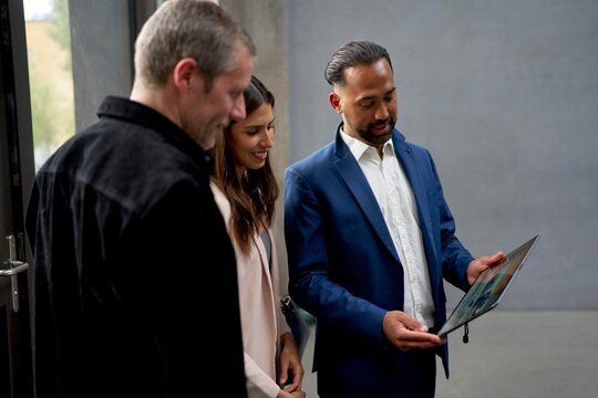 Business Professionals Discussing a Project in a Modern Office