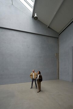 Visitors Explore Modern Space With Minimalist Design