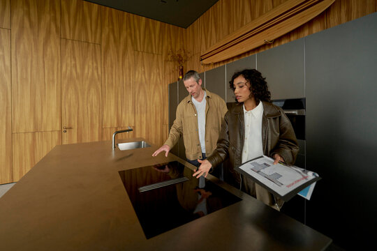 Exploring Modern Kitchen Design With Clients in a Stylish Showroom