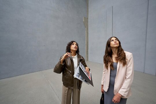 Loft exploration by two women during the day