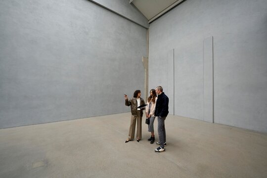 Group discusses contemporary living in minimalist loft space