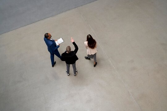 Group discussion in an indoor space with gray floor