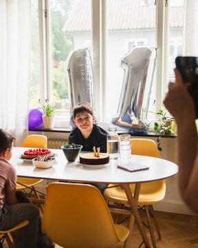 Happy Boy Posing for Photo at His 11th Birthday Celebration