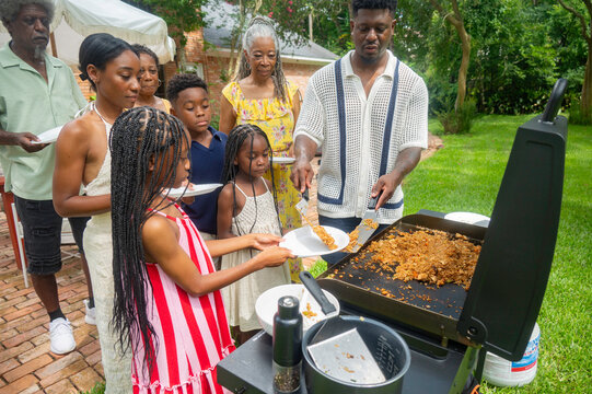 Family gathering meal in the backyard for summer