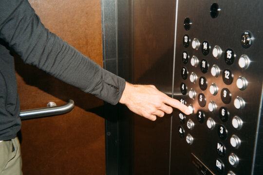 Hand Pressing Elevator Button