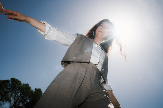 Woman in stylish outfit enjoying sunny day outdoors