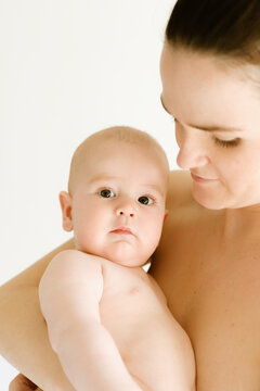 Mother holding her baby in a tender moment of connection