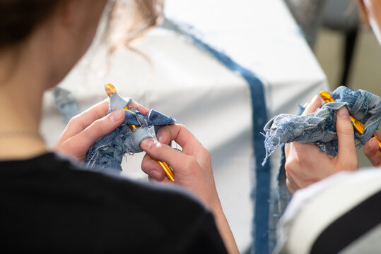 Upcycling. Unrecognizable woman crocheting with yarn