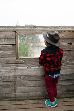 Young Child Dressed as Park Ranger Outdoors

