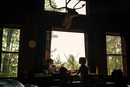 Family breakfast in rustic Upper Peninsula cabin
