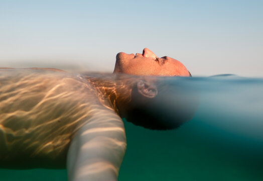 Relaxed man floating in the sea