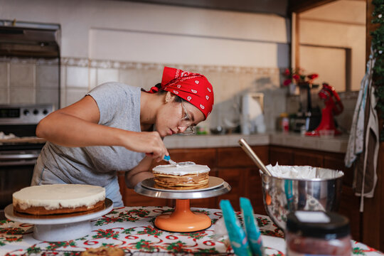 Pastry chef decorating with focus