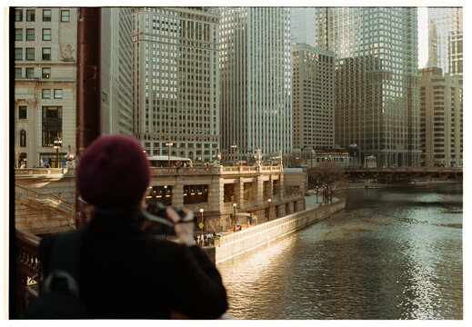 Girl taking photos of the Chicago River