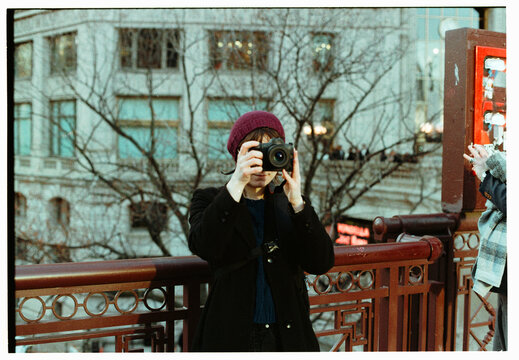 Girl photographer taking photos in Chicago,