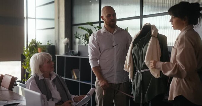 Talented designers share ideas in a modern studio while creating stunning clothing concepts with passion and focus