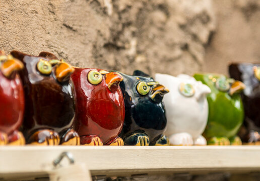 France, Paris, Montmartre.  A row of fat ceramic birds in shop window.