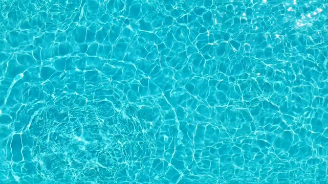 Clear Blue Swimming Pool Water Surface Ripples and Reflections.