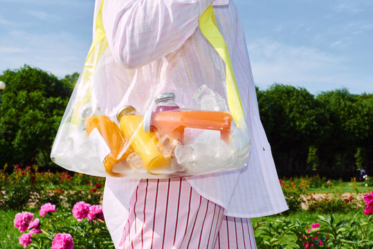 Bright summer day with colorful drinks in a transparent bag