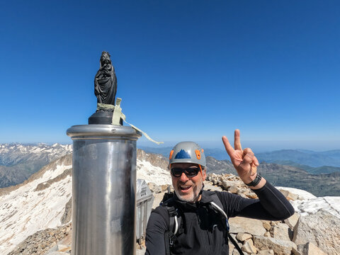 Senior mon reached the top and takes a selfie