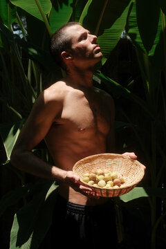 Man Holding Fresh Fruit in Florida