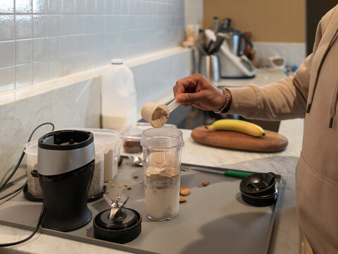Preparing a Nutritious Protein Smoothie With Fruits and Nuts
