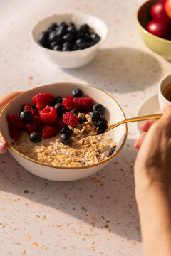 Eating vegan muesli cereal breakfast