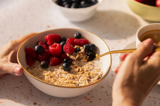 Eating vegan muesli cereal breakfast
