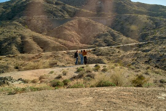 Friends enjoying nature in the hilly desert landscape