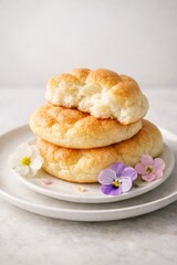 Delicious cloud bread on white plates with colorful flowers