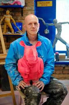
portrait of a male sculptor in his workshop