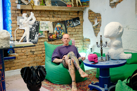 
portrait of a male sculptor in his workshop