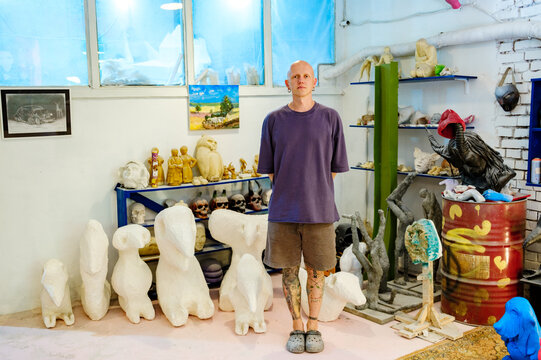 
portrait of a male sculptor in his workshop