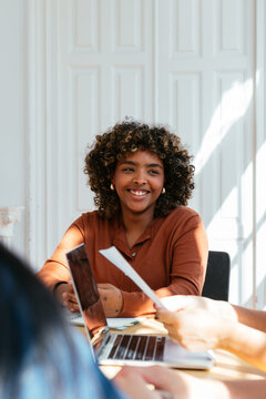 Cheerful businesswoman in modern coworking space