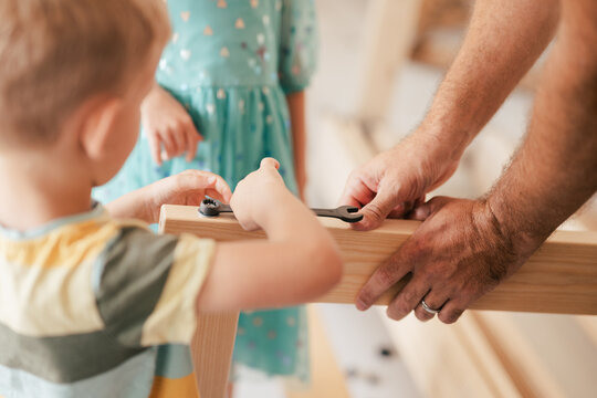 little boy learning carpentry