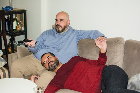 Couple streaming TV at home
