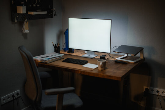 A white-screen computer in a night office