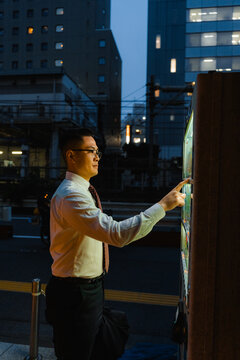A man uses a vending machine with street food