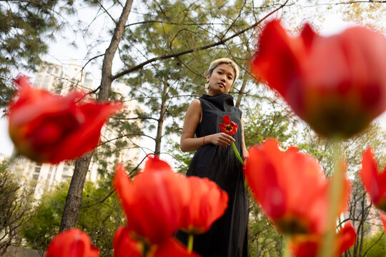 Woman Among Vibrant Flowers