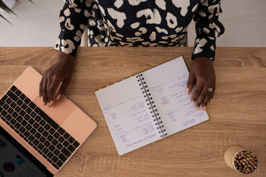 Woman researching financial data and budgeting at office