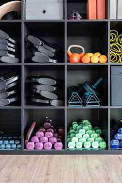 Modern fitness center with various colorful equipment for training