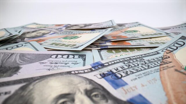 Close up of United States dollar banknotes on white background isolated