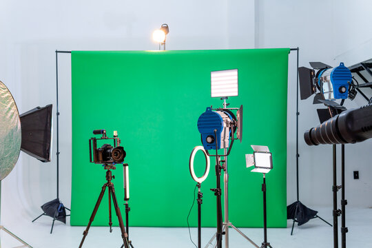 Photography Studio Setup With Green Screen and Lighting Equipment