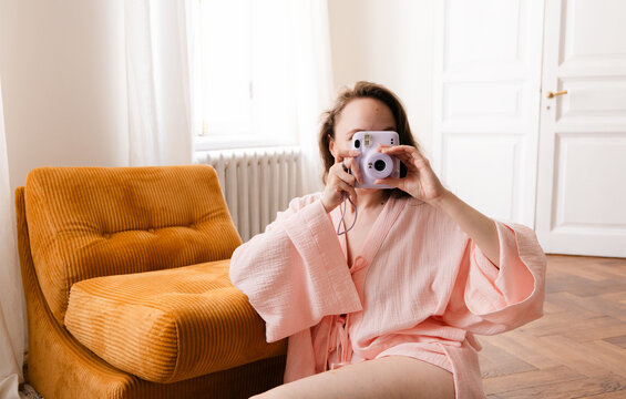  Anonymous Girl with Instant Camera Hiding Face