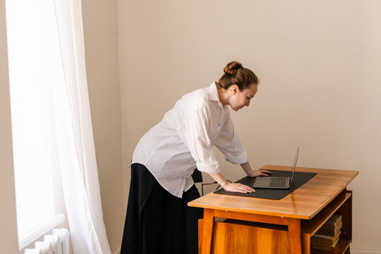  Remote Professional in Mid-Century Home Office
