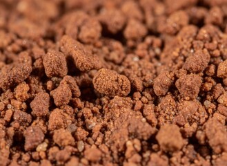 Macro View Of Granulated Instant Coffee Powder With Rich Brown Color And Textured Surface