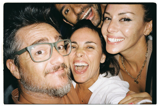 Group of Friends Smiling at Music Festival
