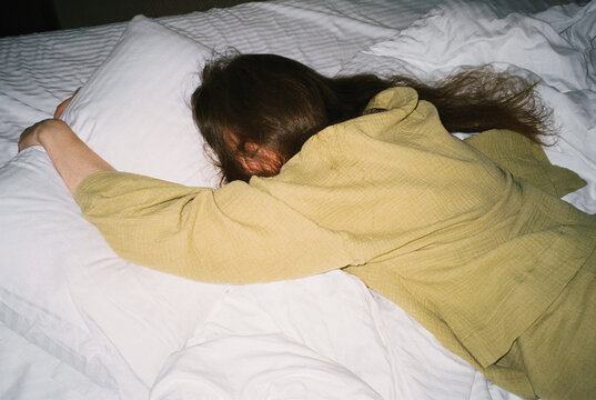 Dreamy woman sleeping on bed
