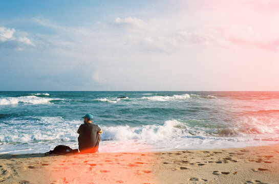 Traveler resting on beach. Copy space. Sri Lanka in film