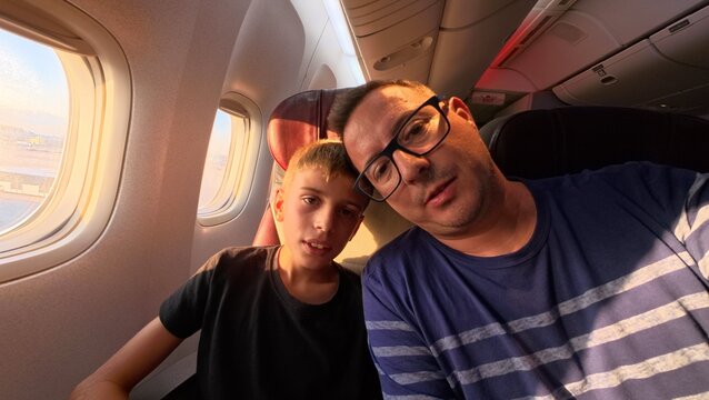 father and son selfie on the plane