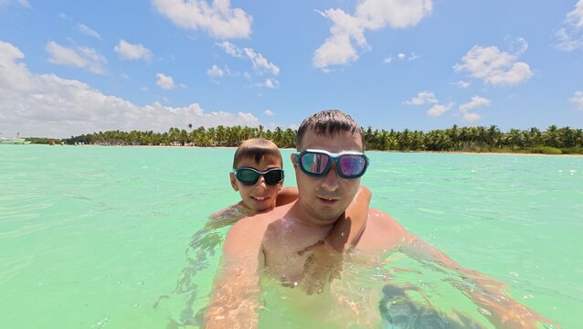Selfie of a father and his son enjoying their vacation 